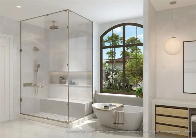 a bathroom with a tub and shower