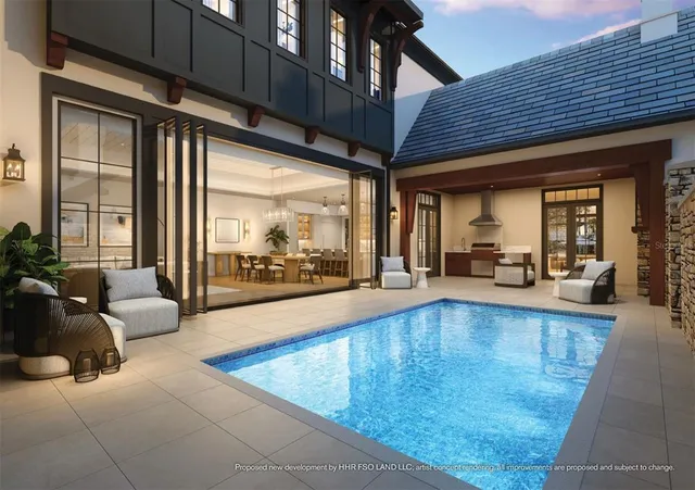 a swimming pool with outdoor seating