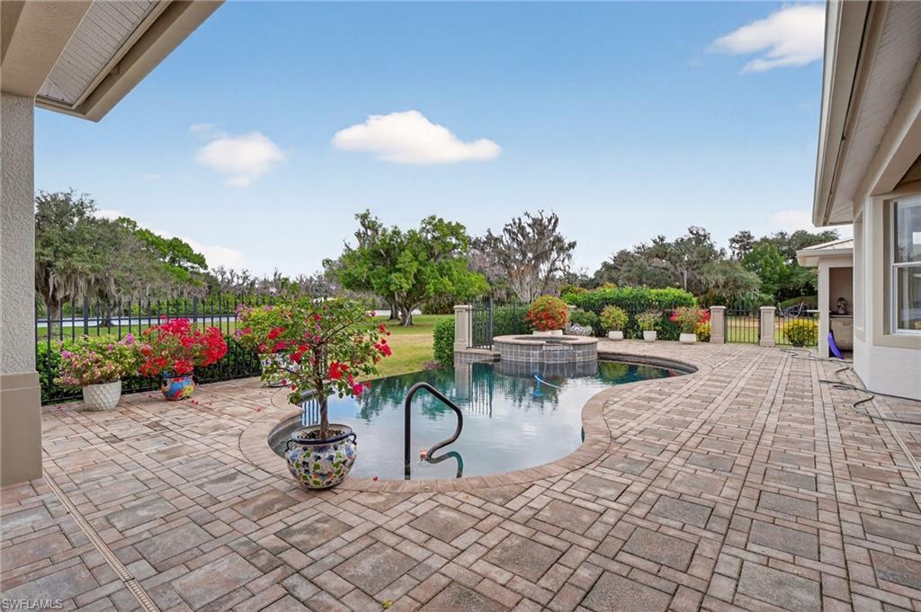 1964 Rialto Way Alva, FL 33920 - Photo 34 of 50 a view of a patio with a table and chairs next to a yard