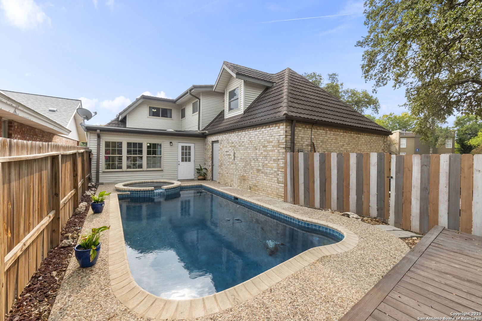 5203 Metcalf Windcrest, TX 78239 - Photo 1 of 37 a view of a house with wooden floor and fence