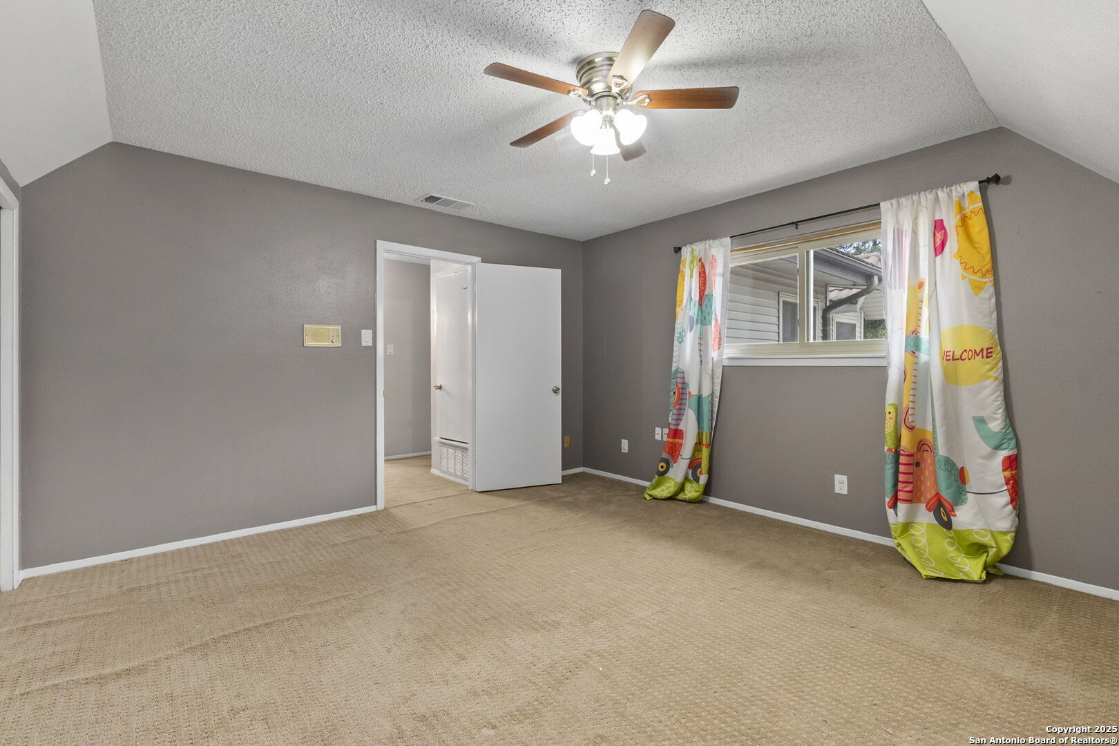 5203 Metcalf Windcrest, TX 78239 - Photo 32 of 37 an empty room with window and ceiling fan