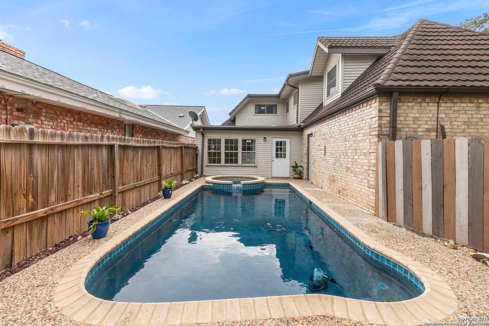 5203 Metcalf Windcrest, TX 78239 - Photo 33 of 37 a view of a house with swimming pool