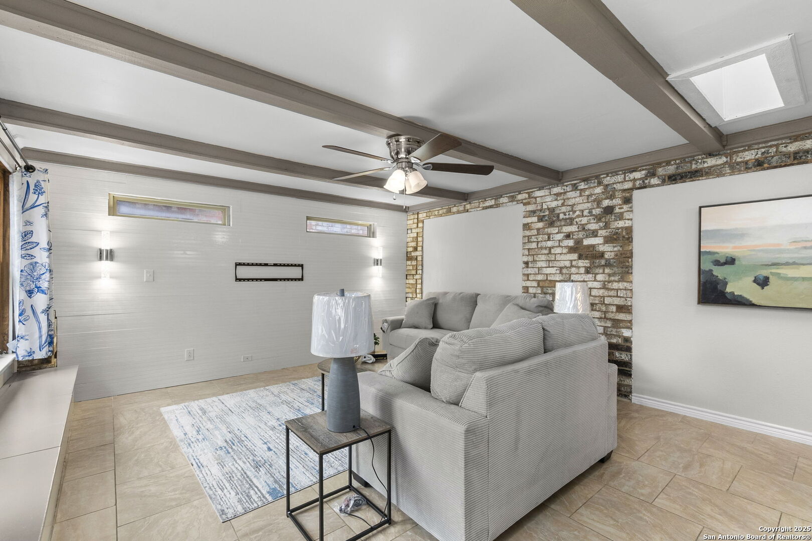5203 Metcalf Windcrest, TX 78239 - Photo 5 of 37 a living room with furniture and a chandelier
