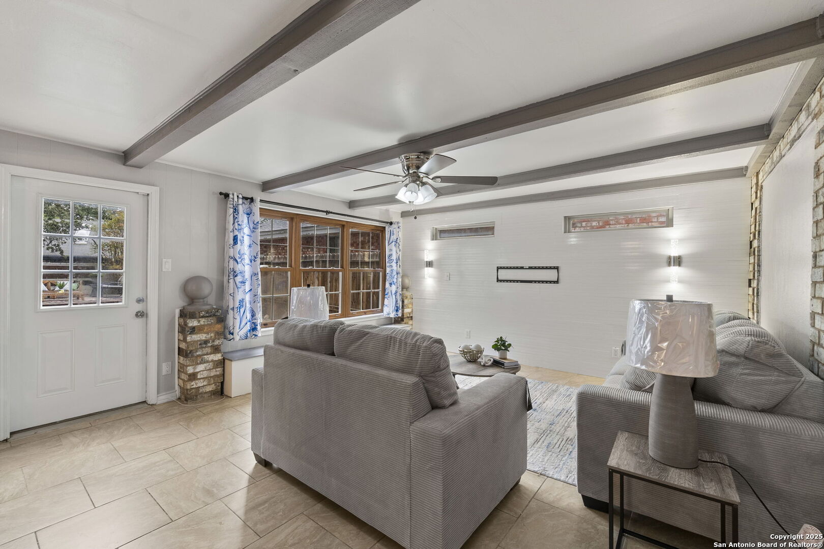 5203 Metcalf Windcrest, TX 78239 - Photo 6 of 37 a living room with furniture and a large window