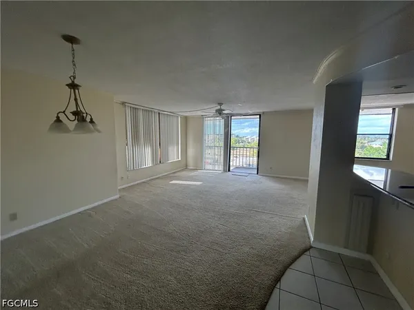 a view of empty room with windows