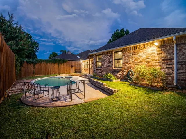 a view of a swimming pool with a lounge chairs