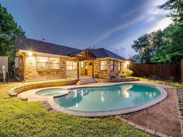 a view of swimming pool with outdoor seating