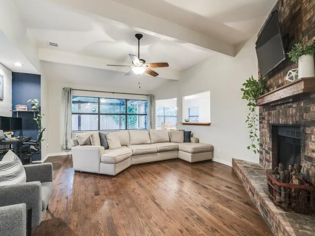 a living room with furniture and a fireplace