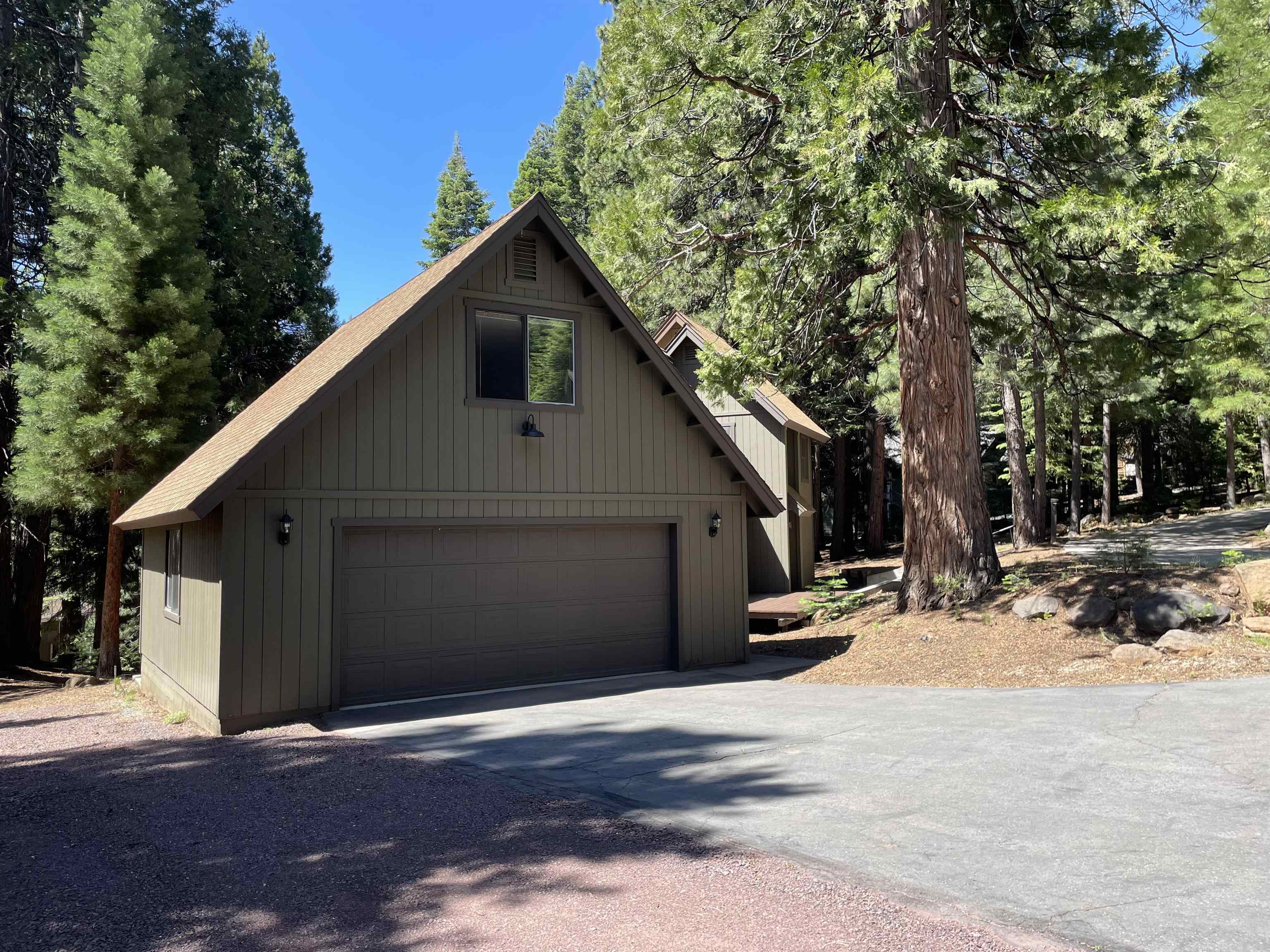 603 East Burnt Cedar Road Lake Almanor, CA 96137 - Photo 3 of 33 a front view of a house with a yard