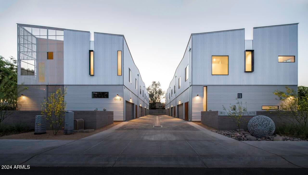 a front view of a house with parking space