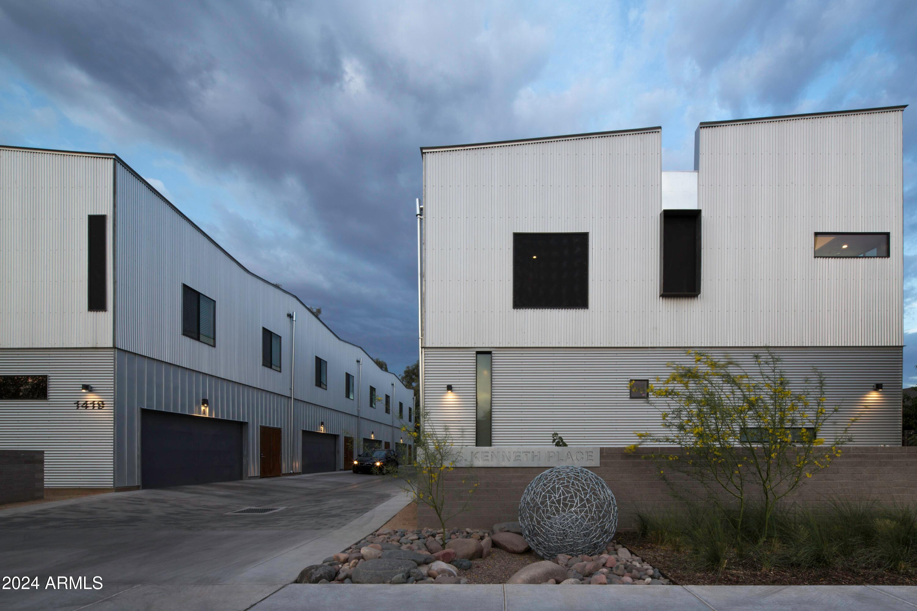1419 South Kenneth Place, Unit 1002 Tempe, AZ 85281 - Photo 14 of 16 a view of a building with many windows
