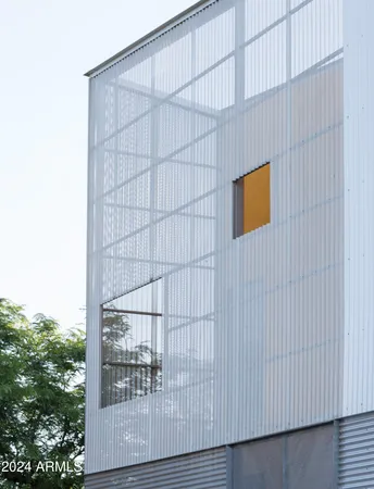 a view of a back view of a house with a balcony