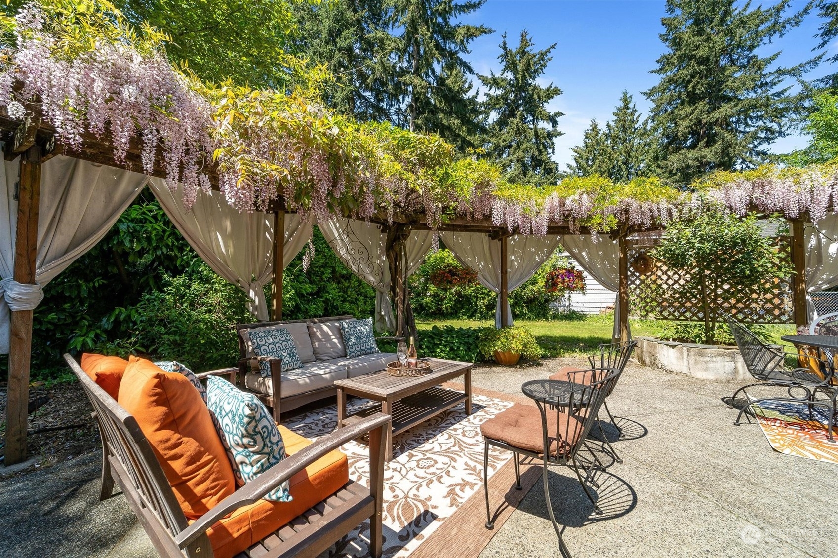 9110 Northeast 179th Place Bothell, WA 98011 - Photo 29 of 35 a backyard of a house with outdoor seating