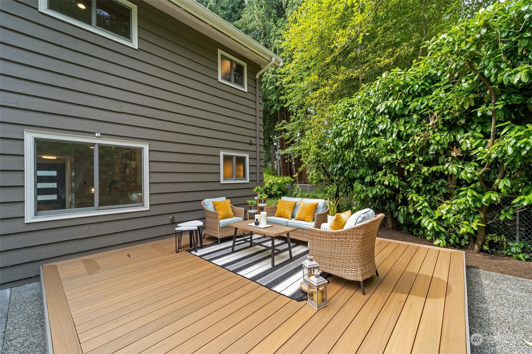 9110 Northeast 179th Place Bothell, WA 98011 - Photo 31 of 35 a backyard of a house with wooden floor yard and outdoor seating