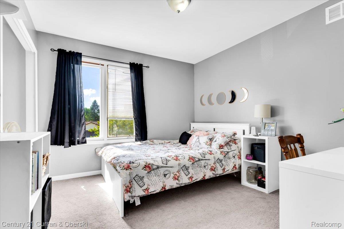 21439 Hall Road Trenton, MI 48183 - Photo 19 of 35 Bedroom featuring light gray walls and gray carpeting