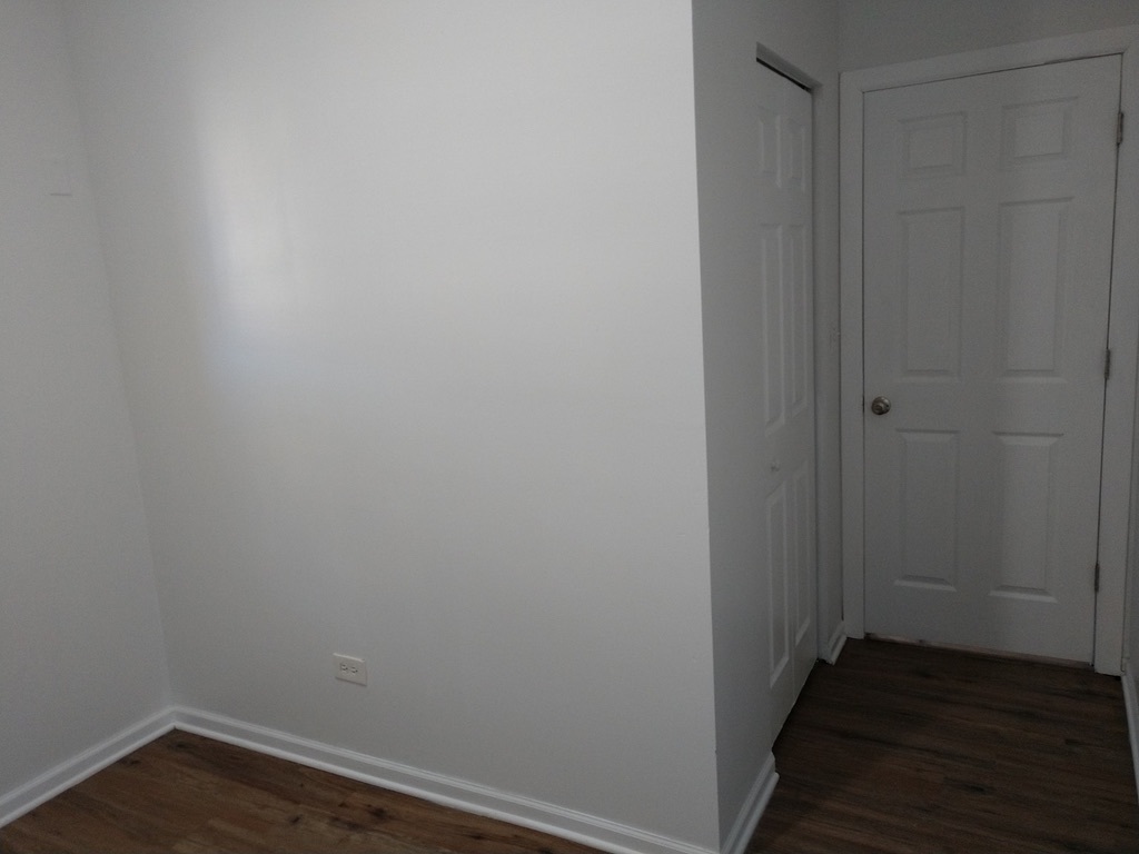 6219 South Rhodes Avenue Chicago, IL 60637 - Photo 19 of 24 a view of small space with wooden floor