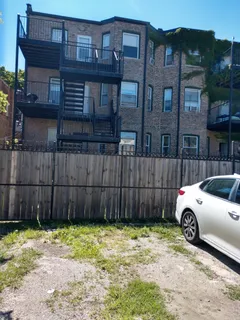 a view of a car park in front of house