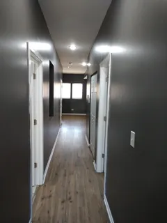 a view of gallery with wooden floor