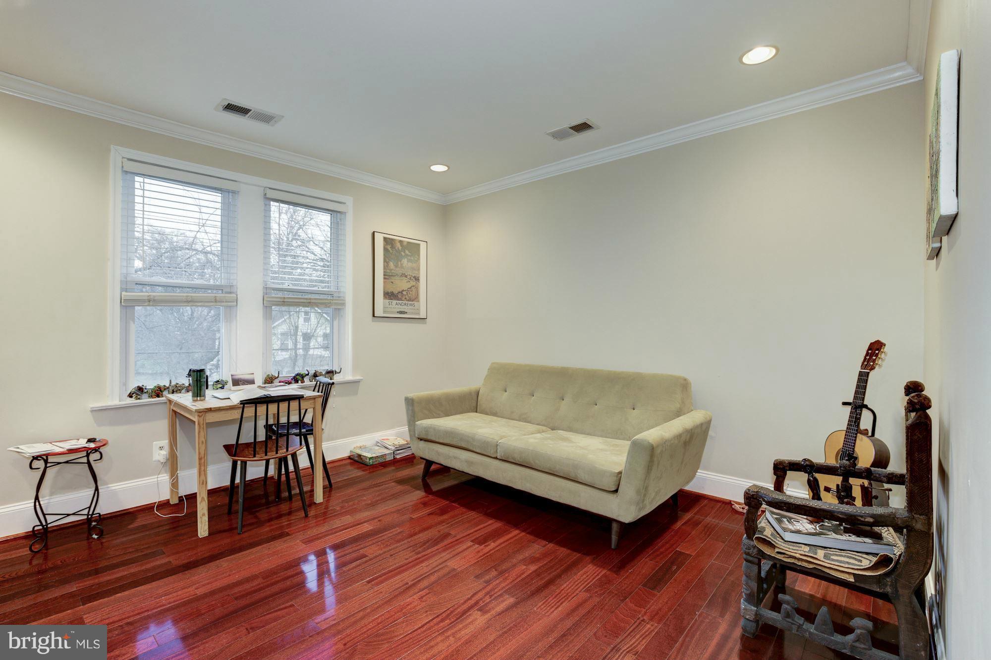 1241 Jackson Street Northeast Washington, DC 20017 - Photo 16 of 30 a living room with furniture a piano and a window