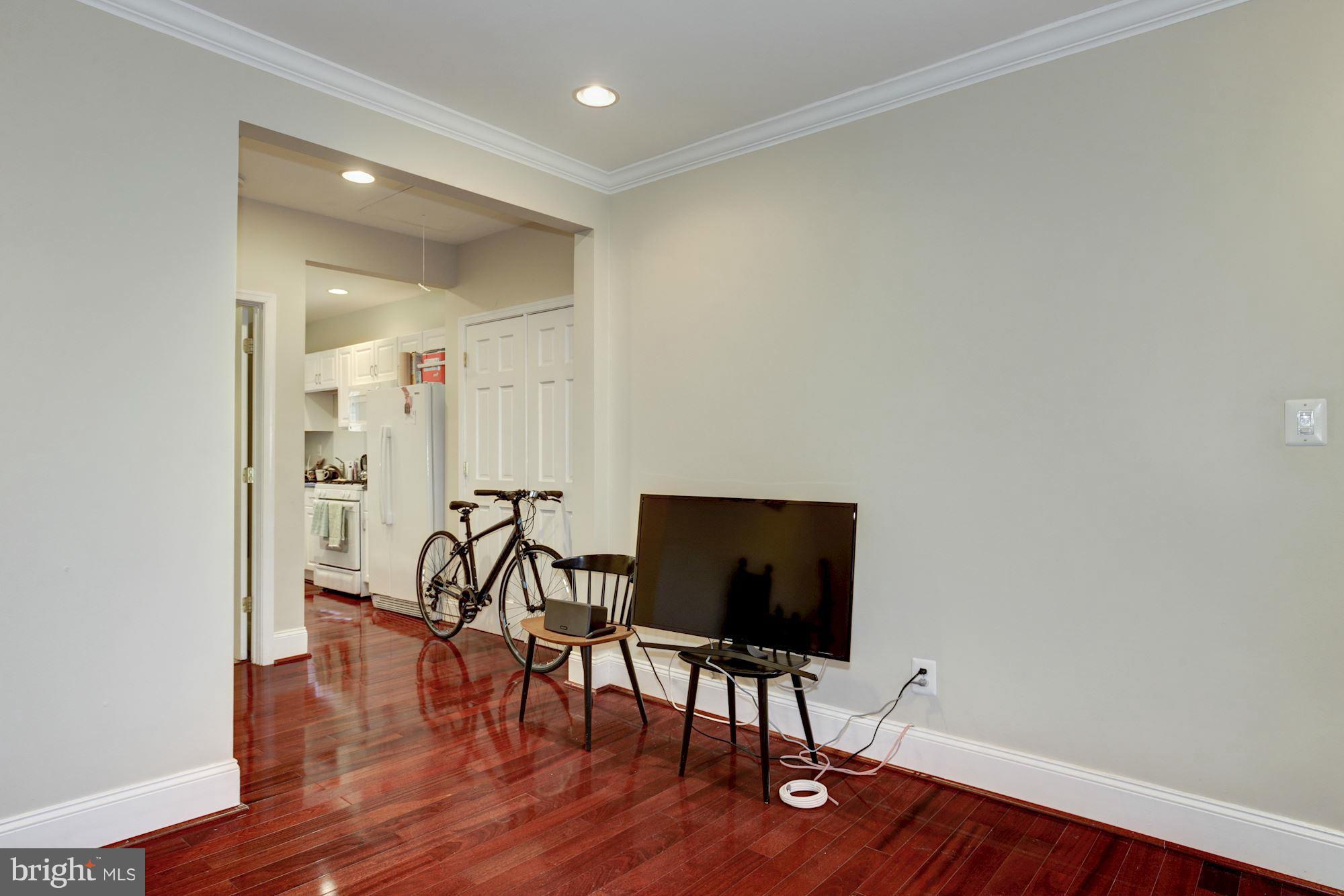 1241 Jackson Street Northeast Washington, DC 20017 - Photo 17 of 30 a view of a workspace with furniture and wooden floor