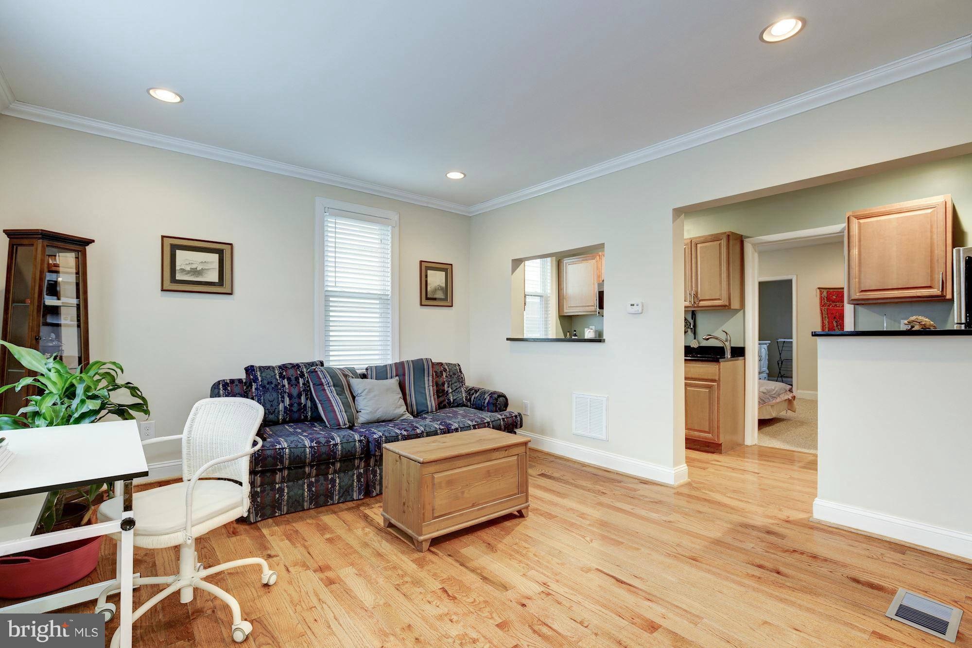 1241 Jackson Street Northeast Washington, DC 20017 - Photo 3 of 30 a living room with furniture and a wooden floor