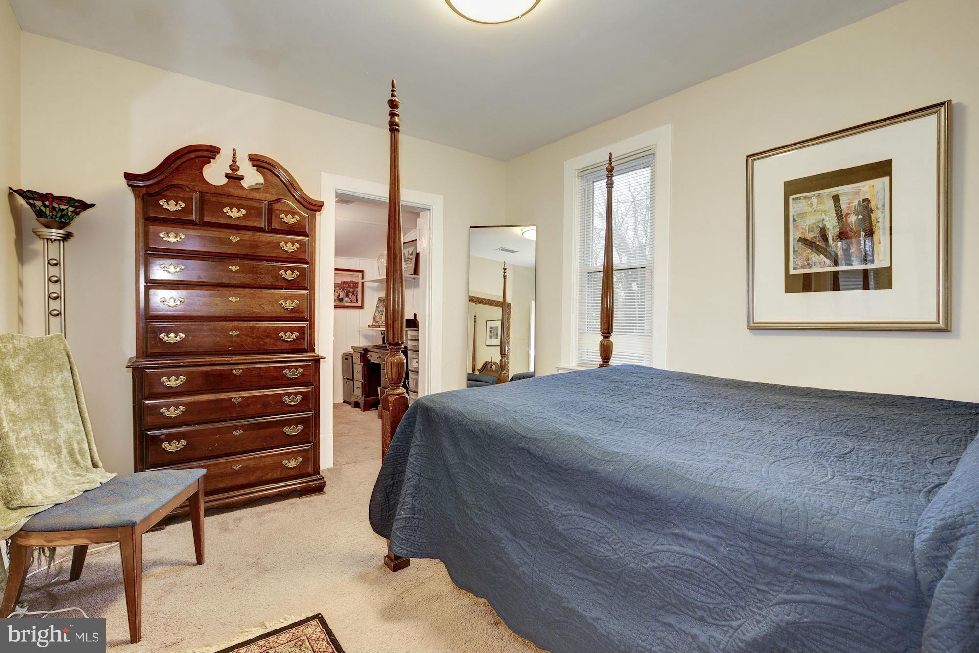 1241 Jackson Street Northeast Washington, DC 20017 - Photo 26 of 30 a bed room with a bed and a chair