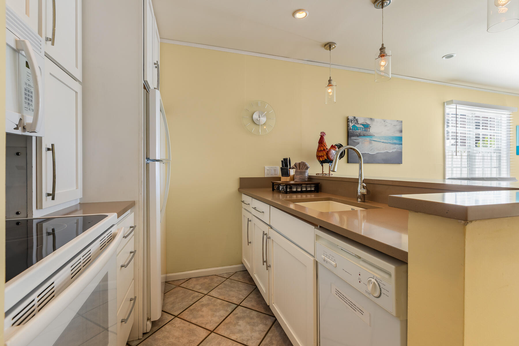 620 Thomas Street, Unit 175 Key West, FL 33040 - Photo 10 of 30 a kitchen with a sink and a refrigerator