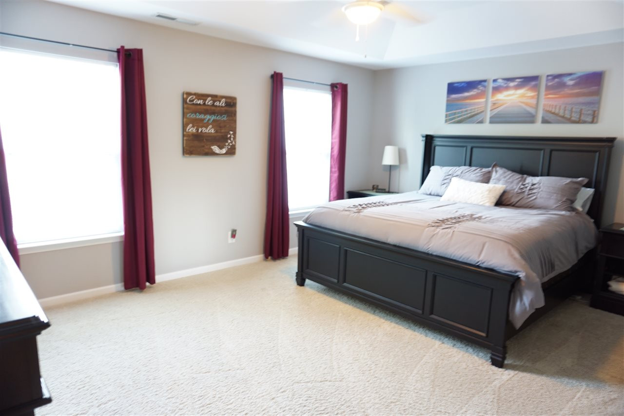 2411 Memory Ridge Drive Raleigh, NC 27606 - Photo 12 of 25 Huge master bedroom with tray ceiling and 2 walk in closets.
