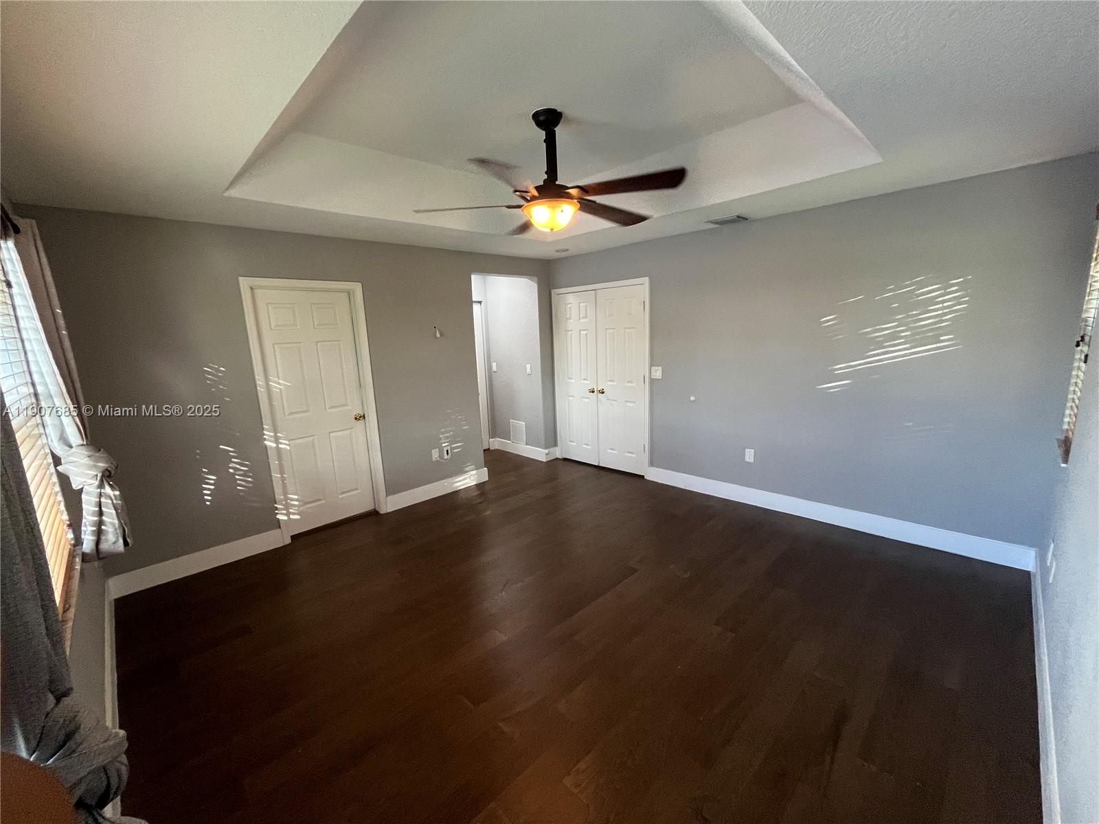 4790 Southwest 165th Avenue Miramar, FL 33027 - Photo 17 of 31 wooden floor in an empty room with a window