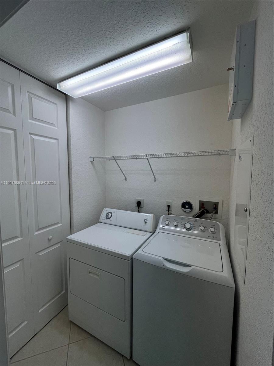 4790 Southwest 165th Avenue Miramar, FL 33027 - Photo 22 of 31 a utility room with dryer and washer