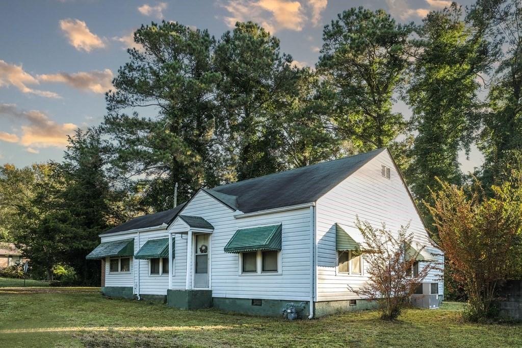 47 Old Goldmine Road Villa Rica, GA 30180 - Photo 1 of 1 a view of a yard in front of a house with large trees