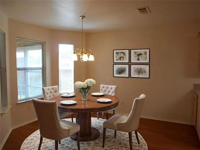 a dining room with furniture and window