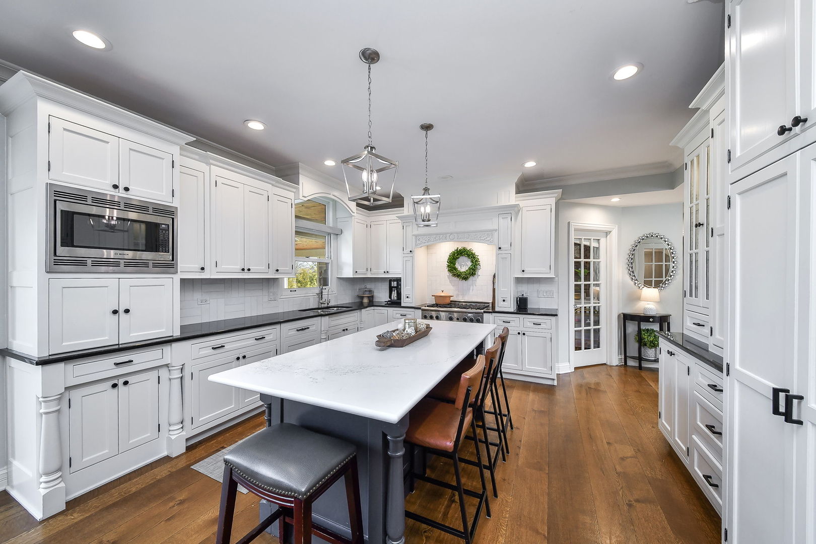75 Hawkins Circle Wheaton, IL 60189 - Photo 12 of 45 a kitchen with stainless steel appliances kitchen island granite countertop a stove a sink and a refrigerator