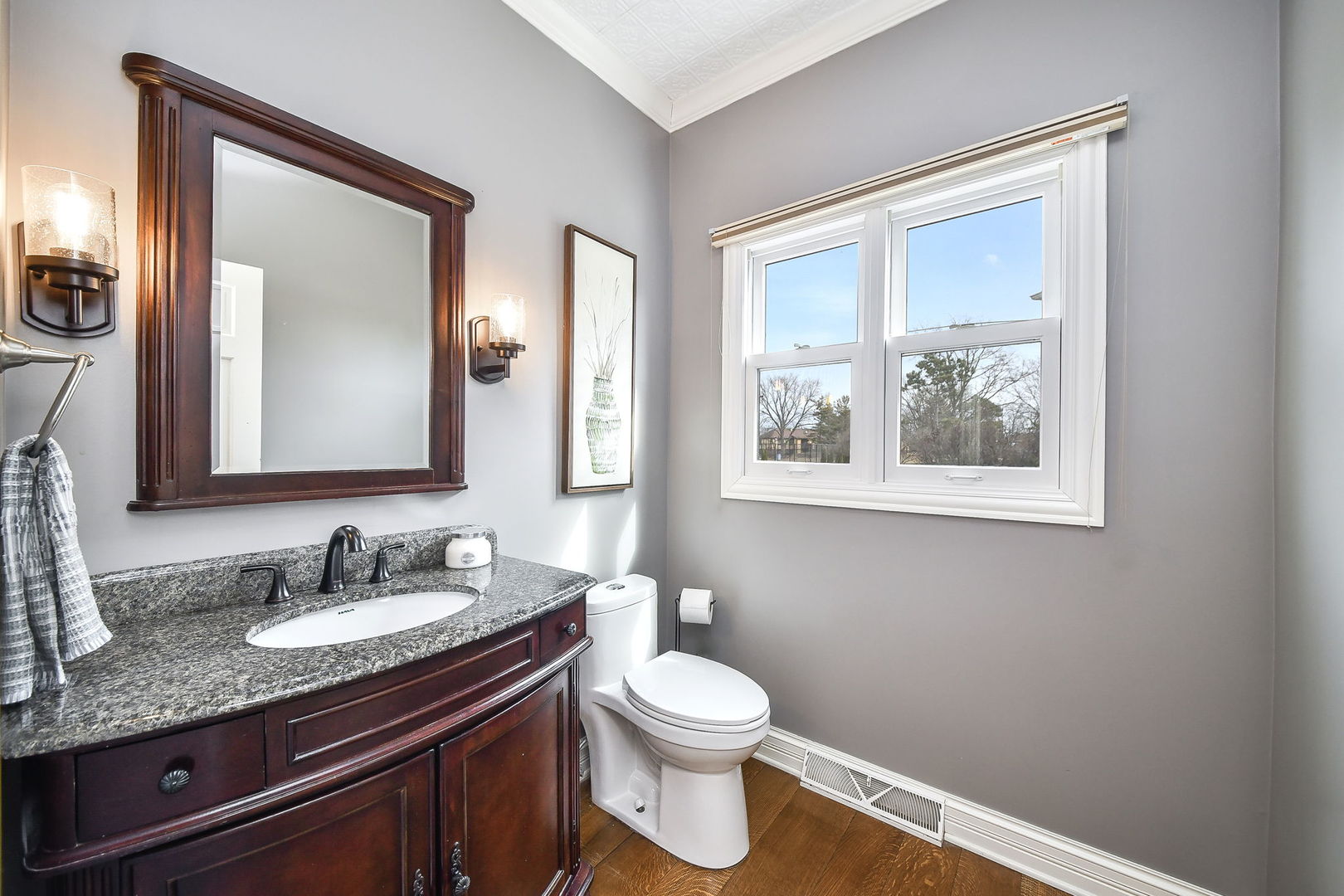 75 Hawkins Circle Wheaton, IL 60189 - Photo 20 of 45 a bathroom with a granite countertop toilet a sink and a mirror