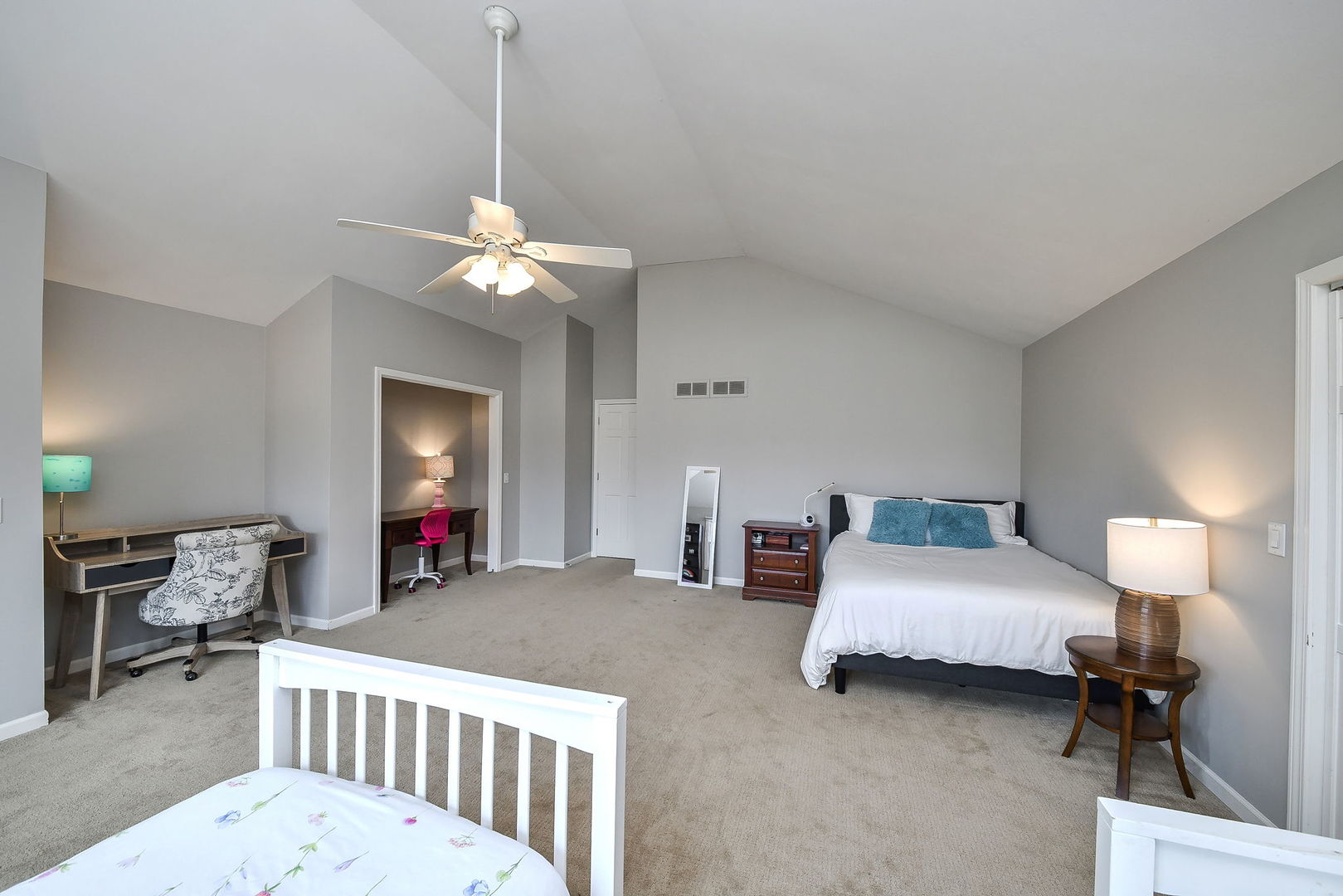 75 Hawkins Circle Wheaton, IL 60189 - Photo 26 of 45 a bedroom with bed and a chandelier