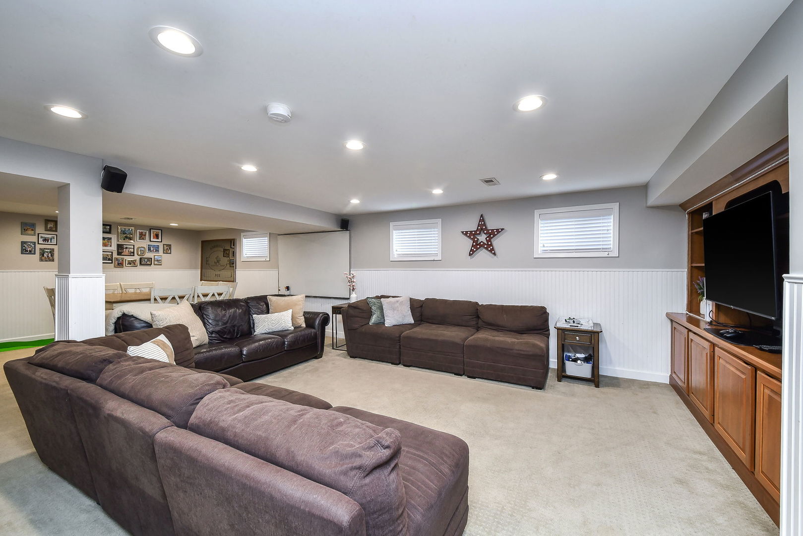 75 Hawkins Circle Wheaton, IL 60189 - Photo 31 of 45 a living room with furniture and a flat screen tv