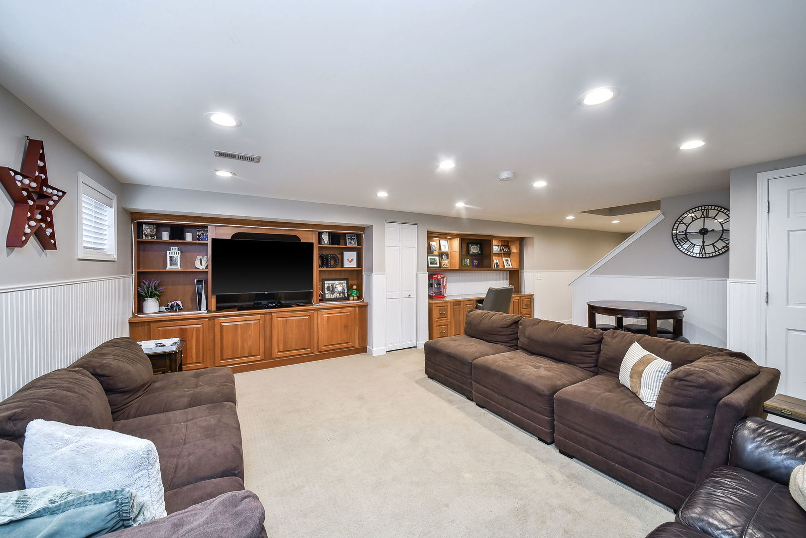 75 Hawkins Circle Wheaton, IL 60189 - Photo 32 of 45 a living room with furniture and a flat screen tv