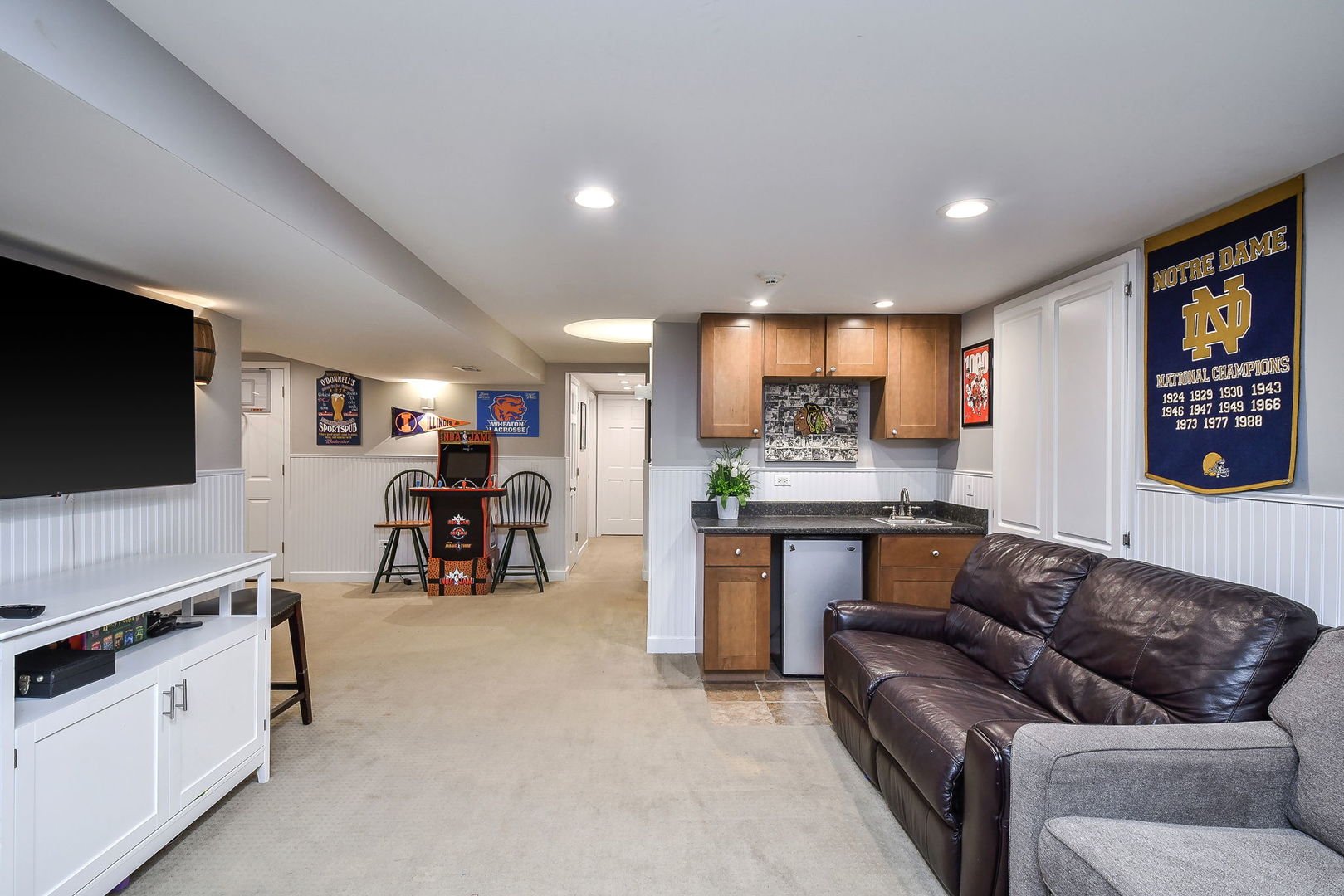 75 Hawkins Circle Wheaton, IL 60189 - Photo 34 of 45 a living room with furniture and a flat screen tv