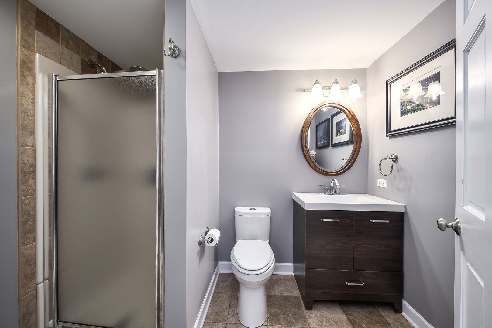 75 Hawkins Circle Wheaton, IL 60189 - Photo 37 of 45 a bathroom with a toilet a sink and a mirror