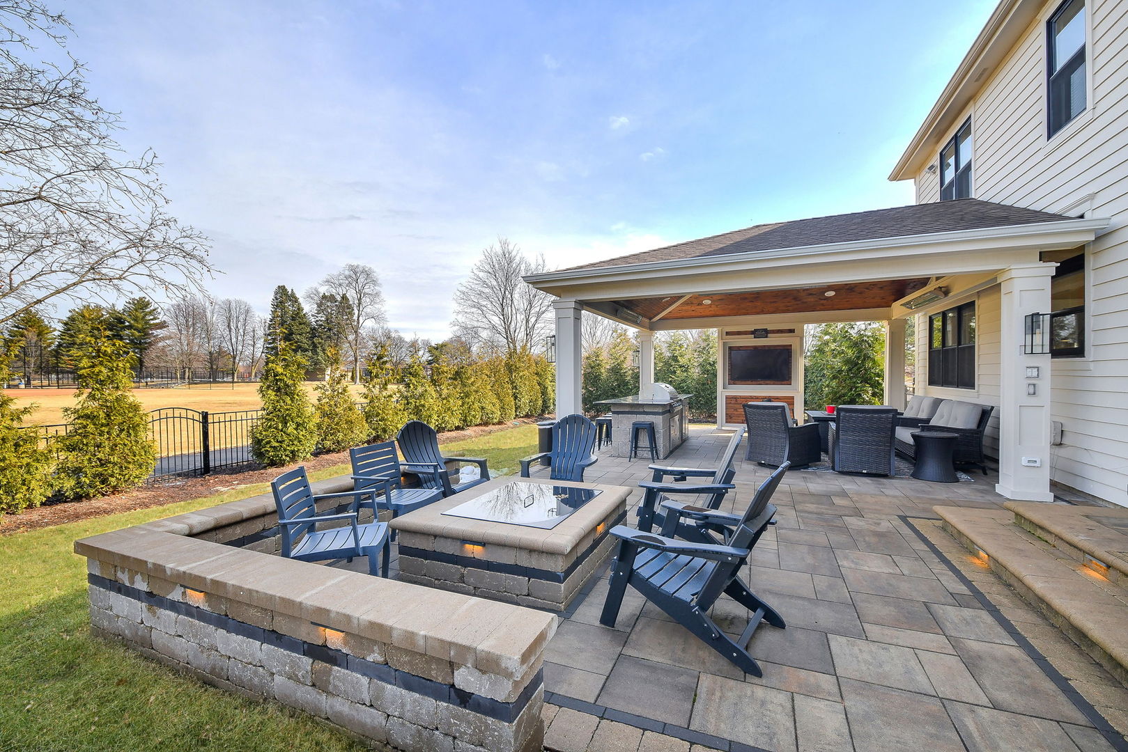 75 Hawkins Circle Wheaton, IL 60189 - Photo 43 of 45 a living room with patio furniture and a fireplace