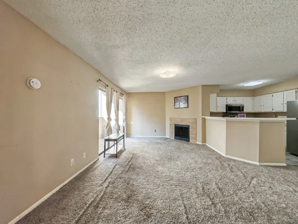 a view of a kitchen with furniture and a window