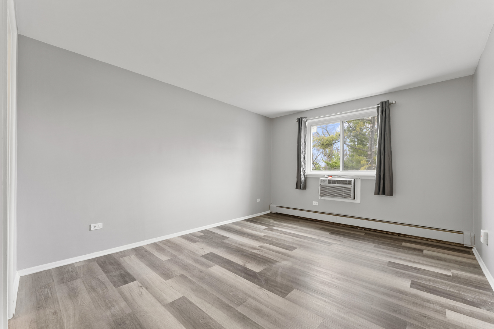 1500 Robin Circle, Unit 203 Hoffman Estates, IL 60169 - Photo 8 of 13 a view of an empty room with a window