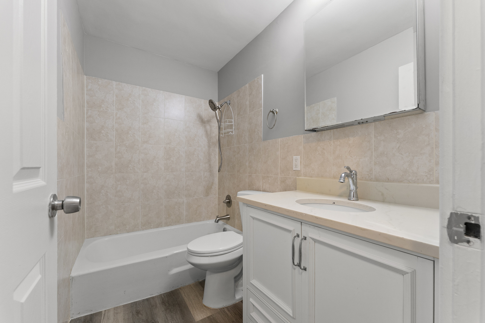 1500 Robin Circle, Unit 203 Hoffman Estates, IL 60169 - Photo 10 of 13 a bathroom with a sink a toilet and shower