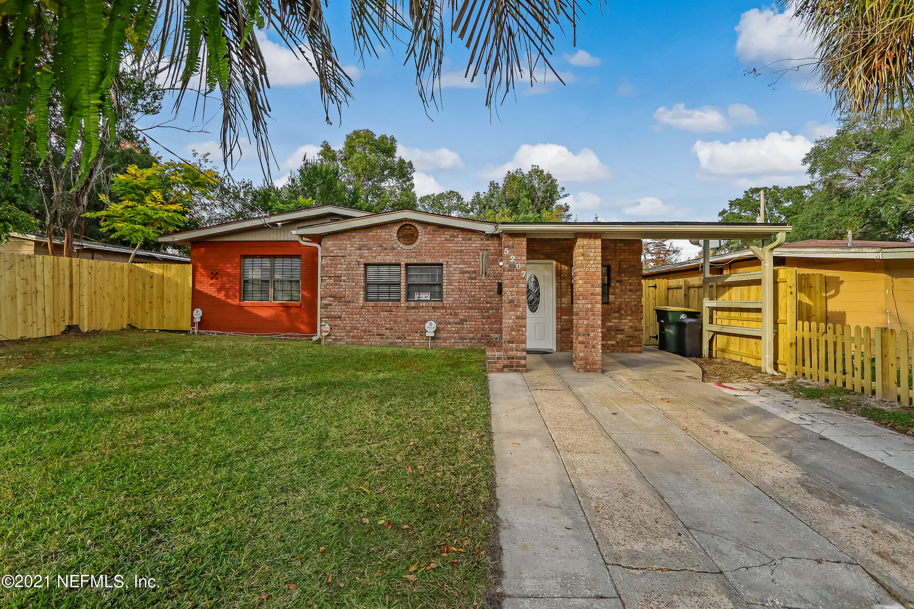5207 Sunderland Road Jacksonville, FL 32210 - Photo 1 of 23 a view of a house with a yard