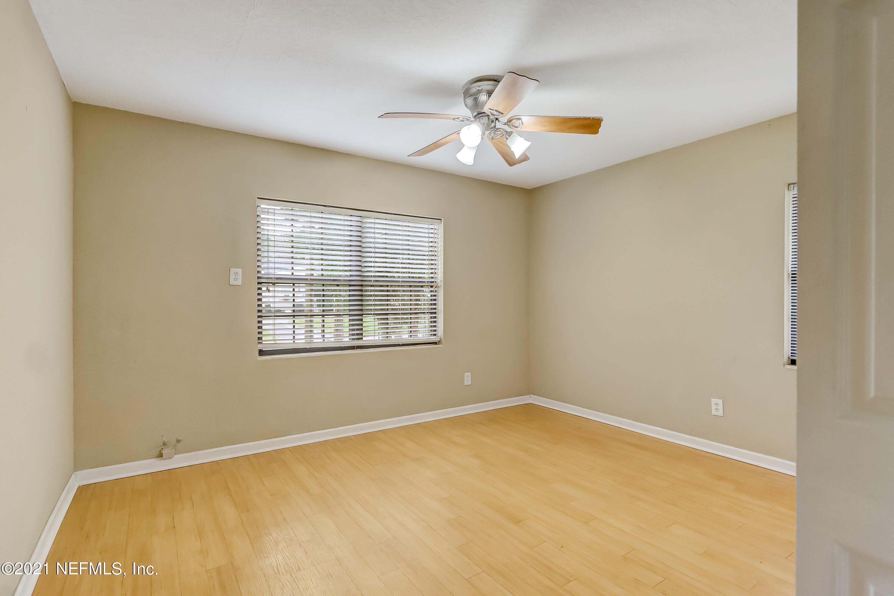 5207 Sunderland Road Jacksonville, FL 32210 - Photo 12 of 23 a view of an empty room with a window