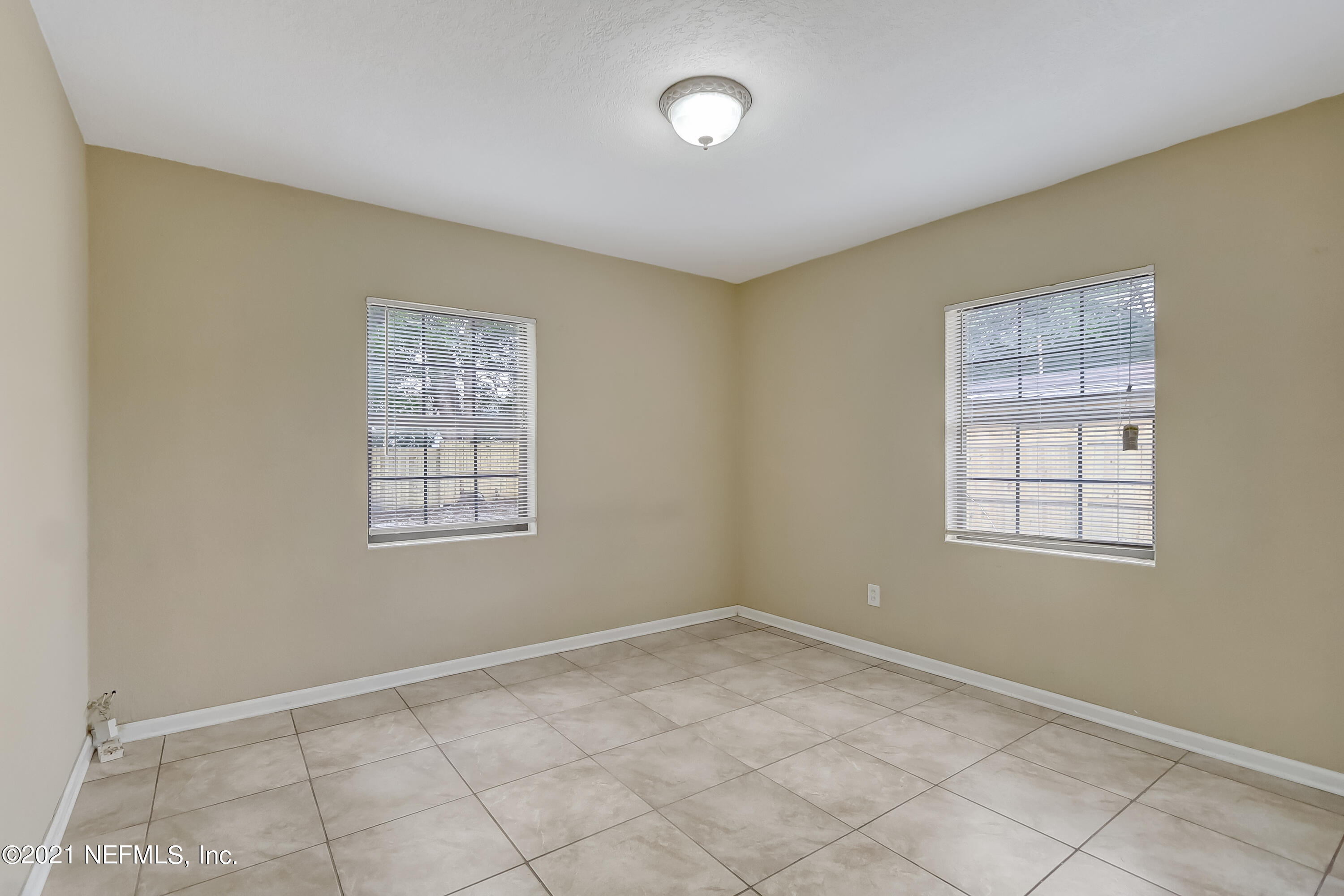 5207 Sunderland Road Jacksonville, FL 32210 - Photo 20 of 23 a view of an empty room with a window