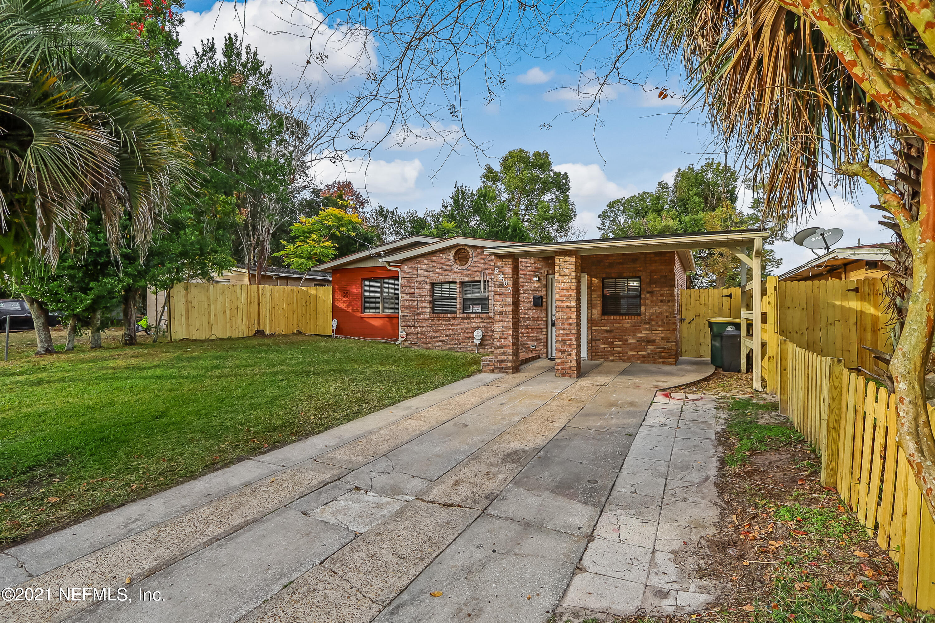 5207 Sunderland Road Jacksonville, FL 32210 - Photo 3 of 23 a view of a house with a yard