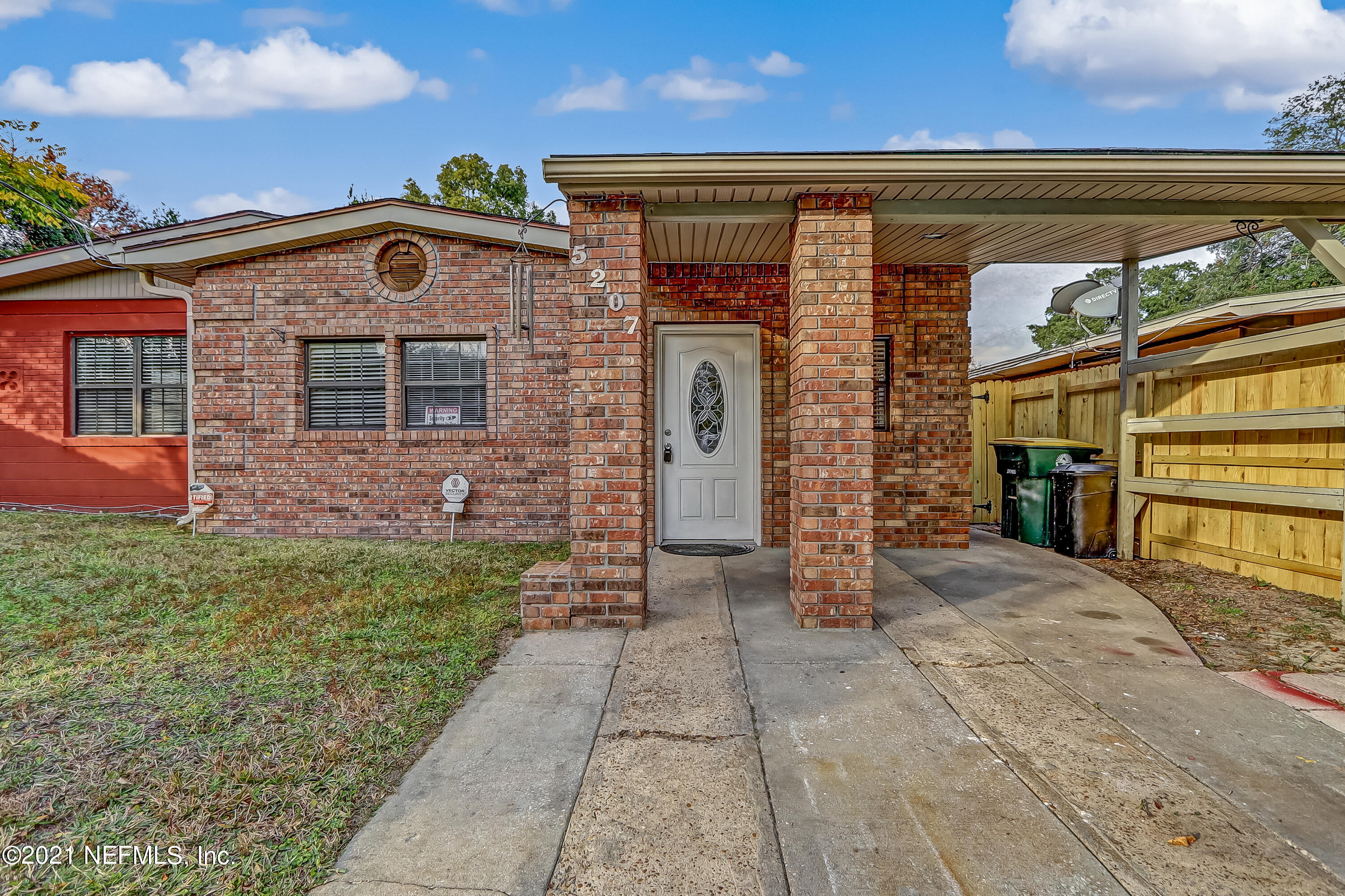 5207 Sunderland Road Jacksonville, FL 32210 - Photo 4 of 23 a front view of a house with a yard