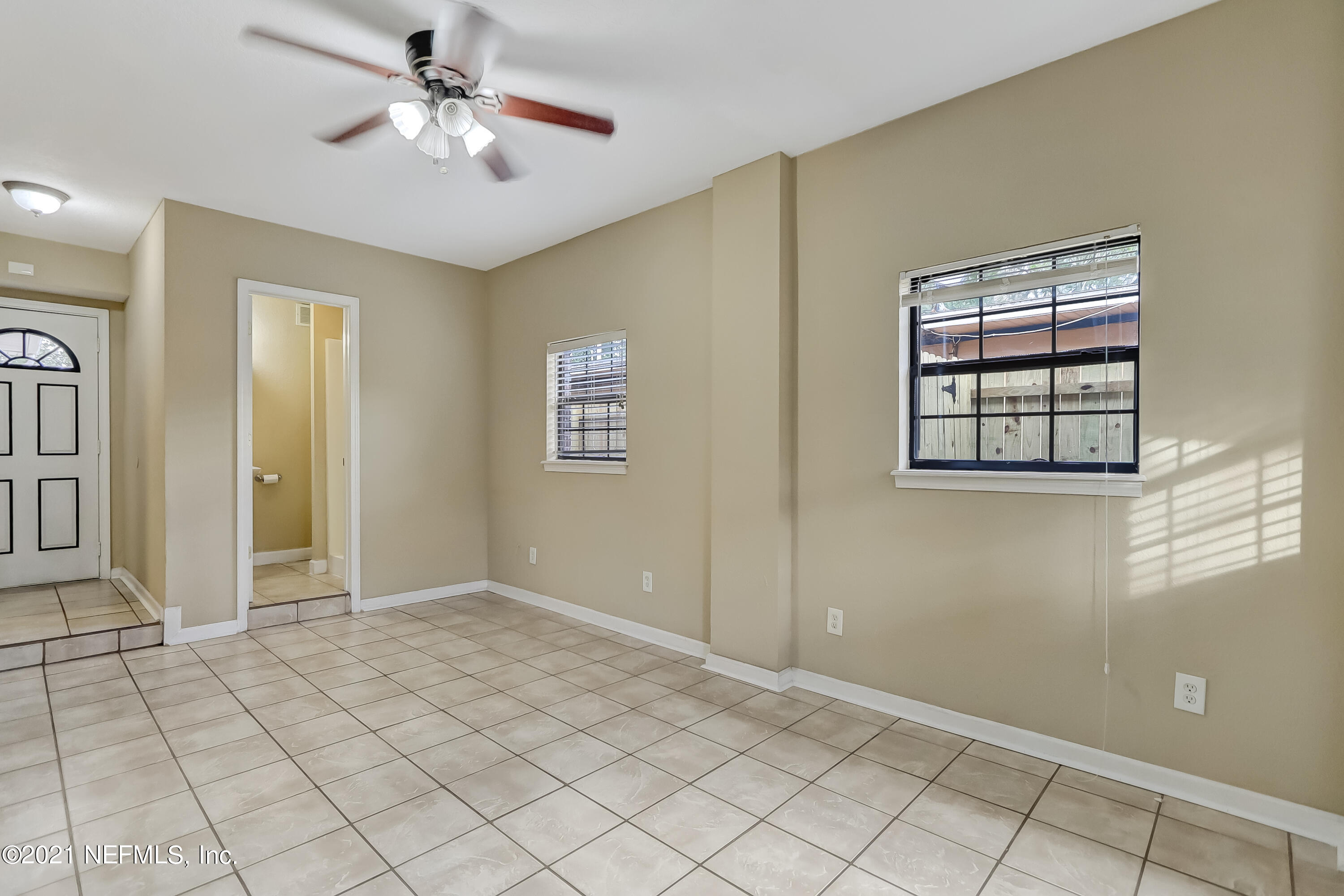 5207 Sunderland Road Jacksonville, FL 32210 - Photo 5 of 23 a view of an empty room with a window