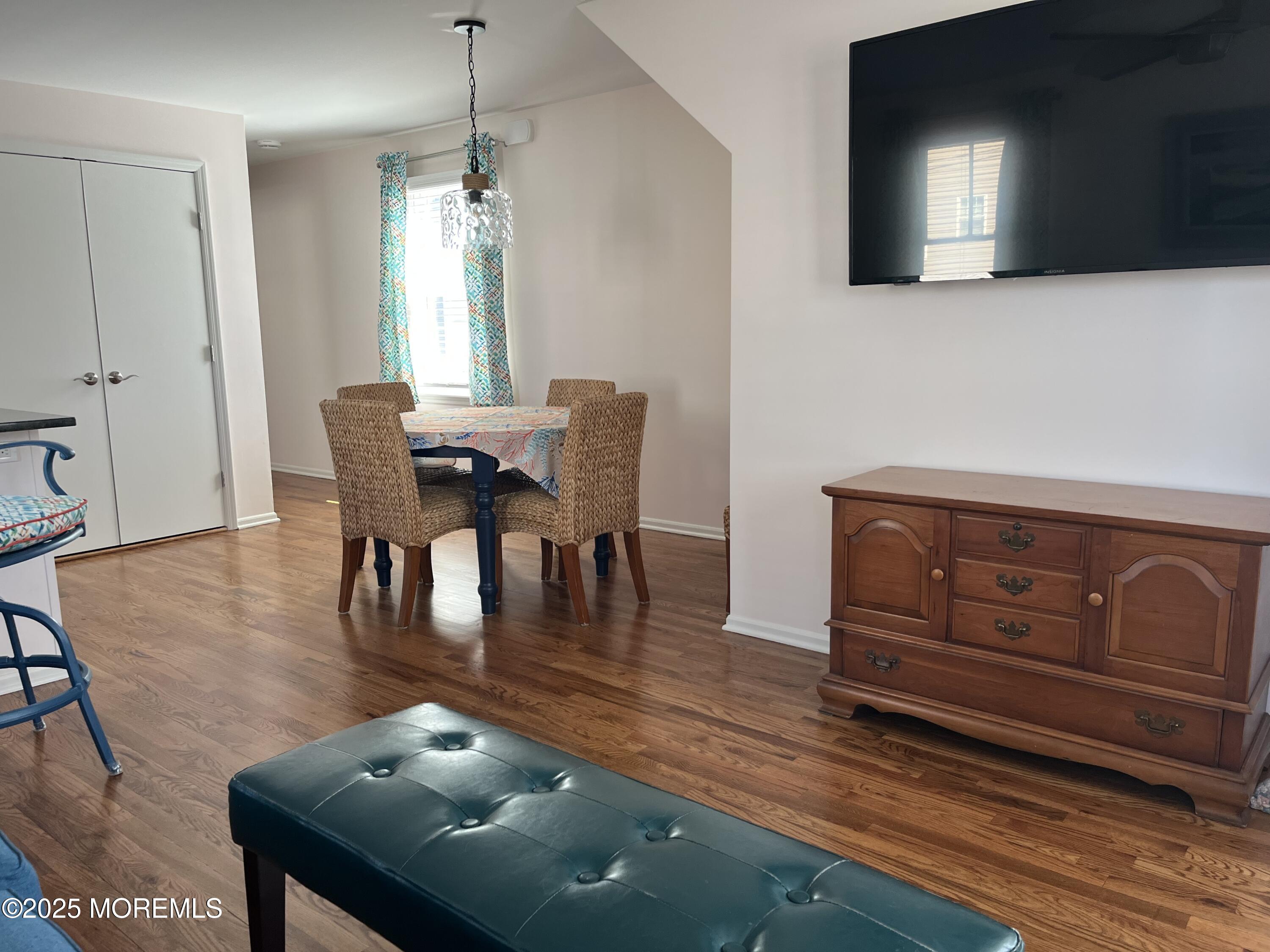 Undisclosed Address Bradley Beach, NJ 07720 - Photo 3 of 13 a dining room with furniture a chandelier and wooden floor